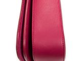 a close up of a red leather purse with a gold clasp