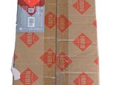 a pile of brown paper with red designs on it