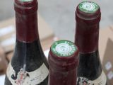 two bottles of wine that are sitting on a table