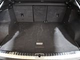 a trunk of a car that has a piano in it