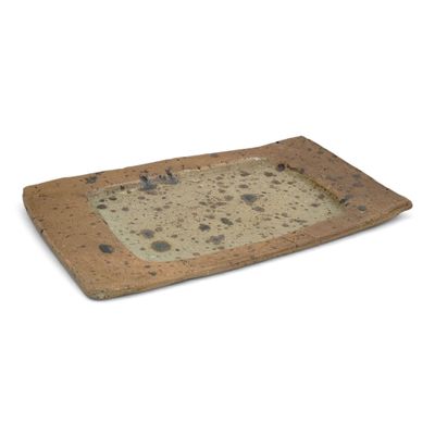 a small tray with rocks on it on a white surface
