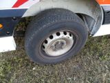a close up of a truck tire on the grass