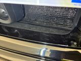 a close up of a radiator on a car ' s hood