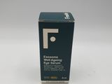 a bottle of eye serum sitting on top of a white table