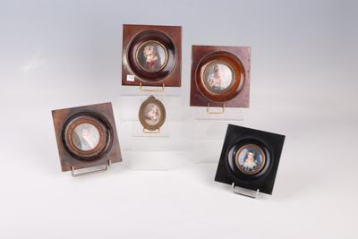 four miniature portraits of a woman and a man in a wooden frame