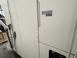 an image of a large white machine in a warehouse
