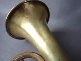 a brass instrument that is sitting on a table