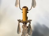 a candle that is hanging from a light fixture