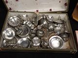 a lot of silver pots and pans in a box