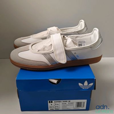 a pair of shoes that are on top of a box