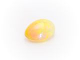 a yellow oplite stone on a white background