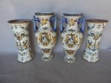 three vases sitting next to each other on a table