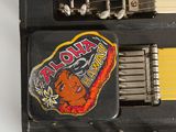 a guitar that has a sticker on the back of it