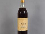 a bottle of wine that is sitting on a table