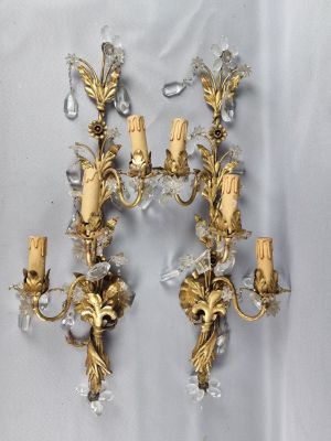 pair of antique brass and crystal sconces on a white background