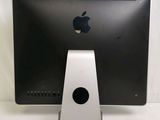 a computer monitor with an apple logo on the screen