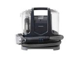 L'aspirateur Black & Decker est posé sur un récipient transparent.