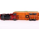 a toy train on a white surface with a white background