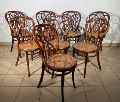 six chairs that are lined up in a row