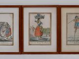 three framed pictures of a man and a woman with a horse and carriage