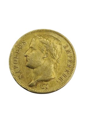 a close up of a gold coin on a white background