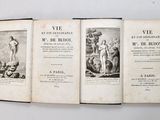 an old book opened to show a picture of a man and a woman