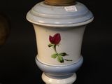 two vases that have been painted with flowers on them