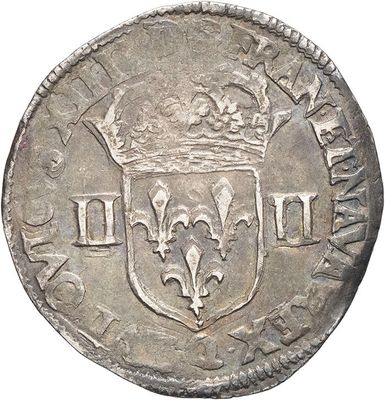 a silver coin with a crown on top of it