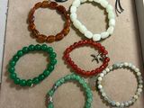 six bracelets in a box with a price tag on them