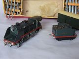 three toy trains sitting next to each other on a table