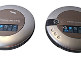 two speakers that are sitting side by side on a table