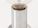 a light bulb that is sitting on top of a metal object