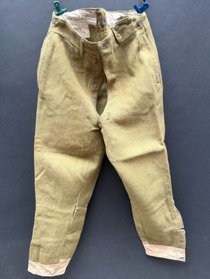a close up of a pair of pants hanging on a clothes line