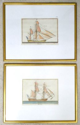 two framed pictures of a ship and a boat on a wall