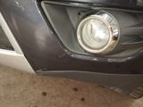 a close up of a car ' s headlight and front bumper