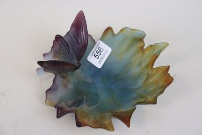 a blue and green leaf shaped bowl with a tag on it