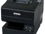 a black printer sitting on top of a white counter top
