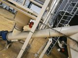 a pipe that is connected to a metal structure