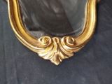 a mirror that is sitting on a black cloth