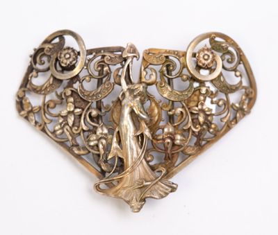 Boucle de ceinture en métal argenté, à décor d'une femme en …