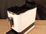a coffee machine that is sitting on a wooden table