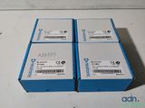 three boxes of electronic equipment sitting on top of a table