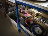 a table with a bunch of boxes and a clock on it