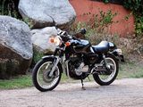 a motorcycle that is parked on the side of the road