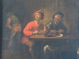 painting of a group of people sitting around a table eating and drinking