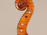 an old violin with a wooden back and a long neck