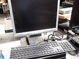 a desktop computer with a keyboard and monitor on a table