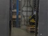 an image of a glass door refrigerator in a warehouse