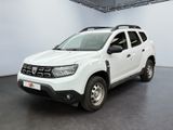 the white dacia is parked in a large white room
