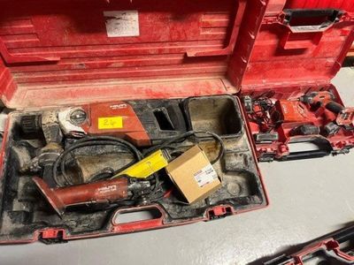 a red tool box with tools in it on a table
